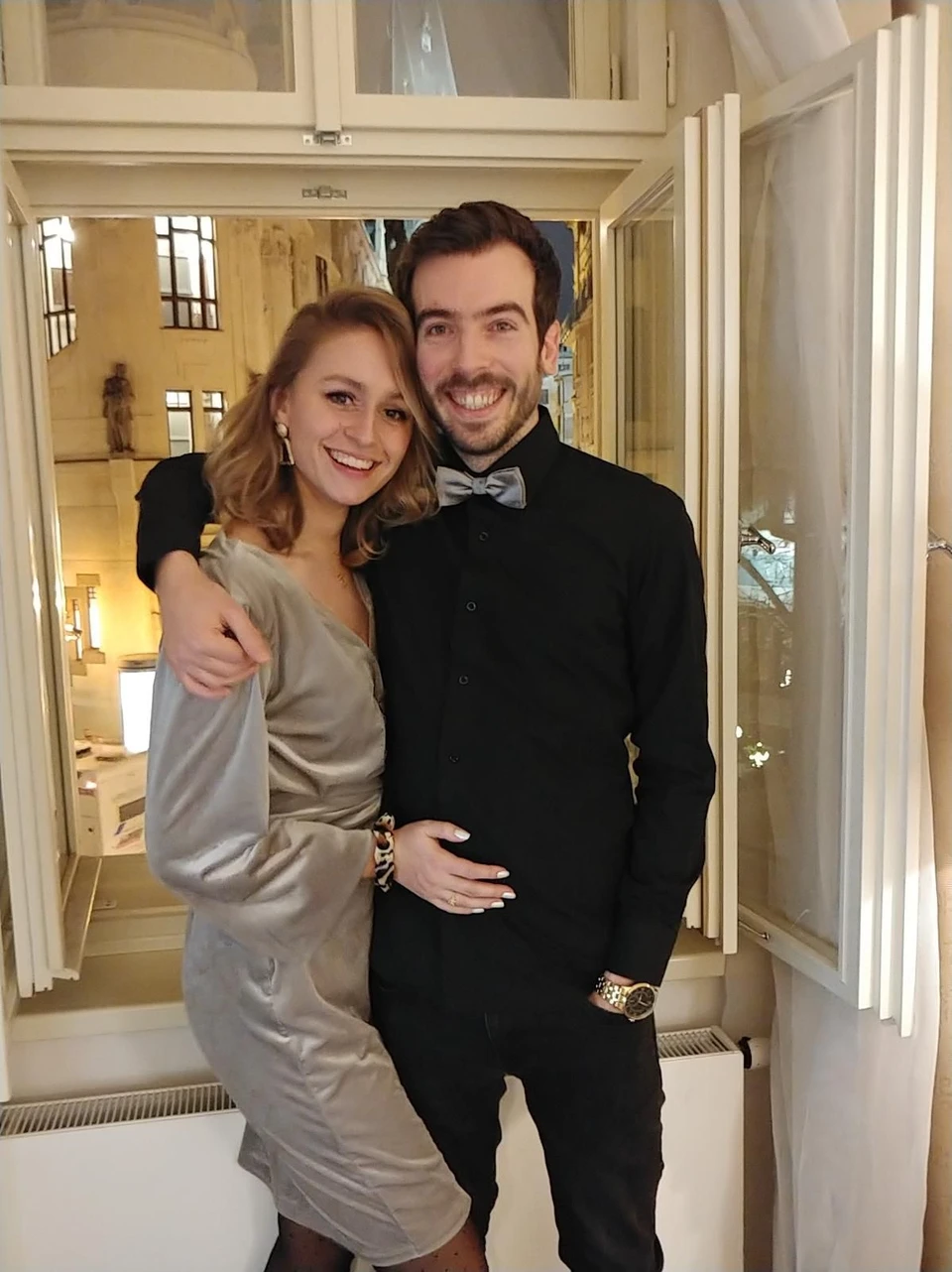 Lisa and Chris dressed up together indoors
